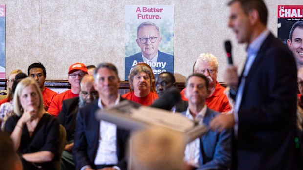 An image of Opposition Leader Anthony Albanese is seen in background as Shadow Treasurer Jim Chalmers speaks during a campaign launch event in Logan, Queensland.