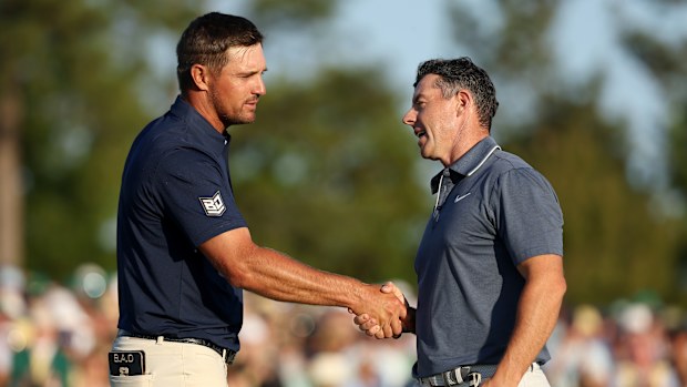 Bryson DeChambeau congratulates Rory McIlroy on his Masters win,