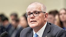 Former Australian Prime Minister Scott Morrison testifies during a House Select Committee on China hearing at the on Capitol Hill, Wednesday, July 23, 2025, in Washington. (AP Photo/Mariam Zuhaib)
