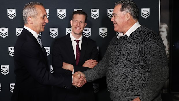 Perth Bears head coach Mal Meninga shakes hands with NRL CEO Andrew Abdo as Bears CEO Anthony De Ceglie looks on.