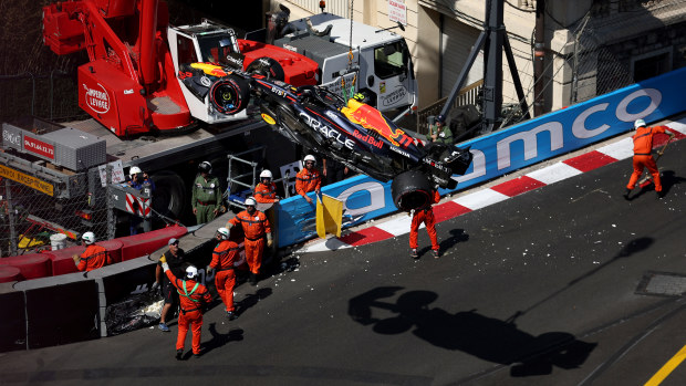 The car of Sergio Perez of Mexico and Oracle Red Bull Racing is removed from the circuit by a crane after he crashed during qualifying ahead of the F1 Grand Prix of Monaco at Circuit de Monaco on May 27, 2023 in Monte-Carlo, Monaco. (Photo by Bryn Lennon - Formula 1/Formula 1 via Getty Images)