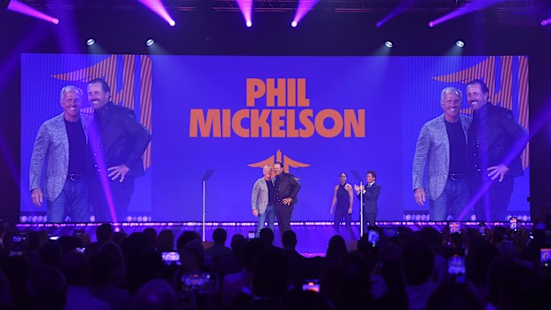 Phil Mickelson on stage with Greg Norman during the LIV Golf Invitational London draft.