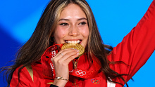 Representing China, Eileen Gu  poses with her gold medal after winning the women's freestyle skiing freeski big air event at the Beijing Winter Olympics.