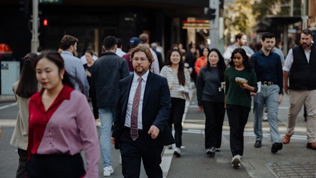 Pedestrians and office workers walk through the Sydney CBD. 