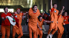 NUVOLA LAVAZZA, TURIN, ITALY - 2024/01/28: The 'Carota Boys' (a group of fans of Jannik Sinner dressed up as carrots) celebrate a point during an event organized at Nuvola Lavazza to watch live on a big screen the Australian Open Final between Jannik Sinner of Italy and Daniil Medvedev of Russia. Jannik Sinner won 3-6, 3-6, 6-4, 6-4, 6-3 claiming his first Grand Slam title. (Photo by Nicolò Campo/LightRocket via Getty Images)
