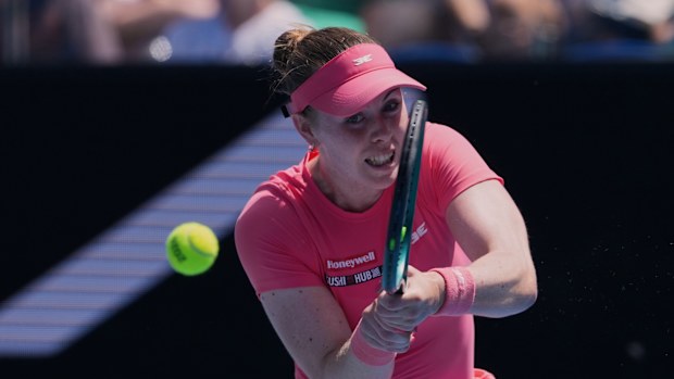 Talia Gibson of Australia plays a backhand return to Diana Shnaider of Russia during their second round match at the Australian Open tennis championship in Melbourne, Australia, Wednesday, Jan. 21, 2026. (AP Photo/Aaron Favila)