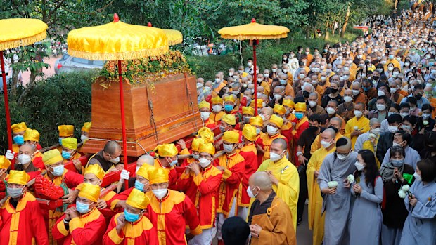 Coffin of Vietnamese renowned monk Thich Nhat Hanh is carried to the street during his funeral.