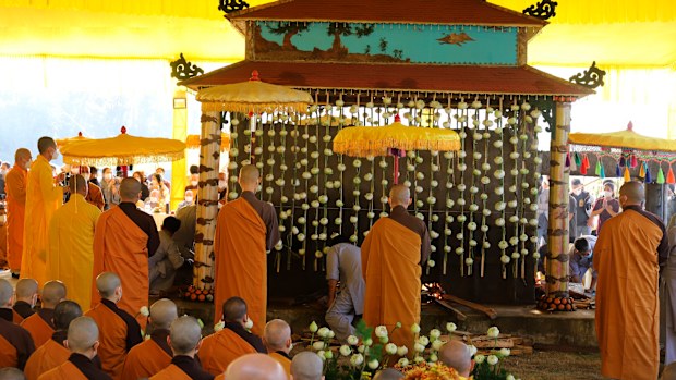 Buddhist monks attend the cremation of Thich Nhat Hanh in Hue, Vietnam.