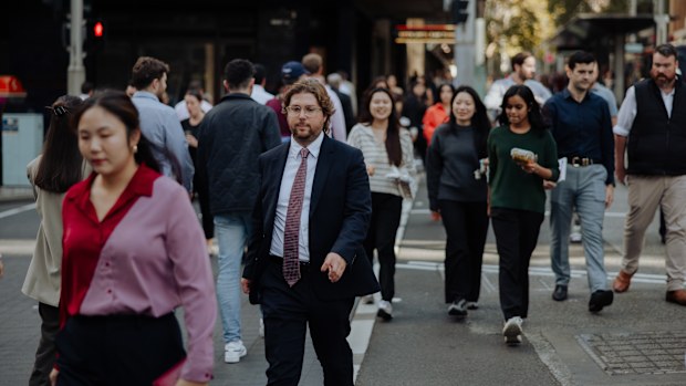 Pedestrians and office workers walk through the Sydney CBD. 