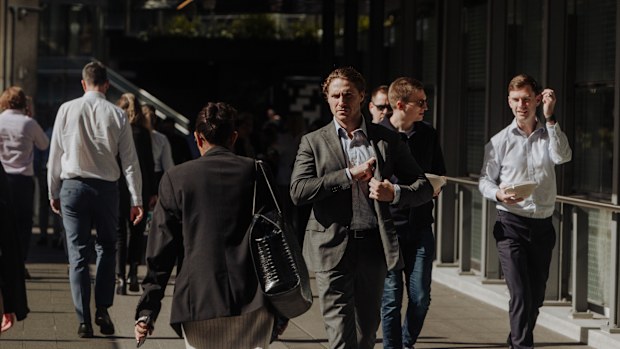 Pedestrians and office workers walk through the Sydney CBD. 