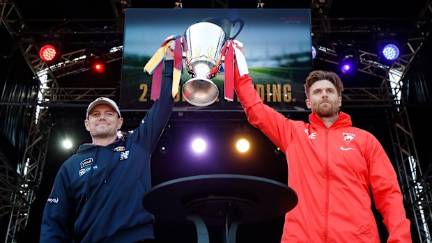 Lachie Neale of the Lions and Dane Rampe of the Swans hold the Premiership Cup aloft during the 2024 AFL Grand Final Parade on September 27, 2024 in Melbourne, Australia. (Photo by Michael Willson/AFL Photos via Getty Images)