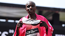 LONDON, ENGLAND - APRIL 26: Sabastian Sawe of Team Kenya celebrates with his adidas shoe after winning with a new World Record time during the Mens 2026 TCS London Marathon on April 26, 2026 in London, England. (Photo by Alex Davidson/Getty Images)