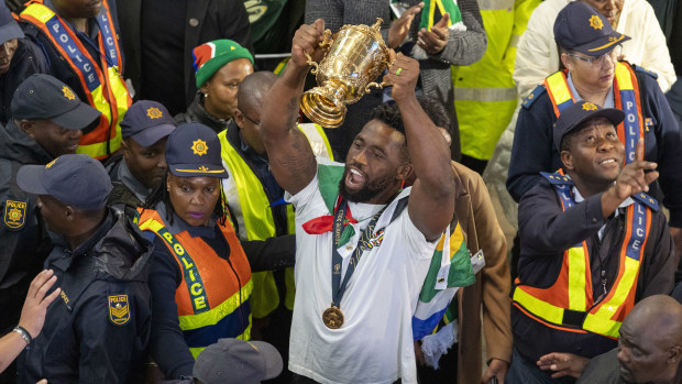 Springboks caption Siya Kolisi lifts the Webb Ellis Cup at OR Tambo International Airport.