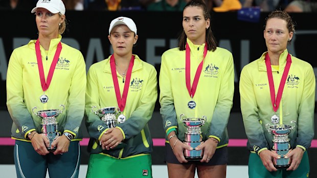 Sam Stosur (right) loves playing in team events like the Fed Cup.