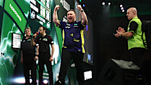 Luke Littler celebrates his win in the final. 