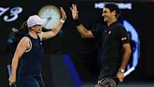 MELBOURNE, AUSTRALIA - JANUARY 17: Ash Barty of Australia and Roger Federer of Switzerland react during the Opening Ceremony exhibition match ahead of the 2026 Australian Open at Melbourne Park on January 17, 2026 in Melbourne, Australia. (Photo by Graham Denholm/Getty Images)