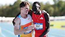 PERTH, AUSTRALIA - APRIL 13: Lachlan Kennedy of Queensland congratulates Gout Gout of Queensland after the Men's 200m Final during the 2025 Australian Open and Under 20 Athletics Championships at WA Athletics Stadium on April 13, 2025 in Perth, Australia. (Photo by Cameron Spencer/Getty Images)