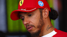 Lewis Hamilton fronts media.