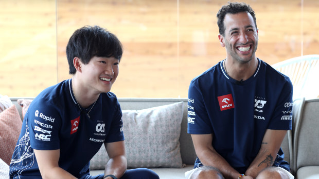 Yuki Tsunoda of Japan and Scuderia AlphaTauri and Daniel Ricciardo of Australia and Scuderia AlphaTauri talk to the media in the Paddock during previews ahead of the F1 Grand Prix of Hungary at Hungaroring on July 20, 2023 in Budapest, Hungary. (Photo by Peter Fox/Getty Images)