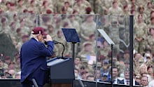 The atmosphere resembled a state fair with military flair. 