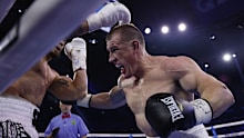 Paul Gallen punches Sonny Bill Williams during their heavyweight bout at Qudos Bank Arena on July 16, 2025, in Sydney, Australia.