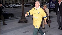 John Howard strides out.