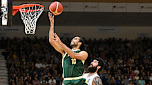 Xavier Cooks of the Boomers drives to the basket.