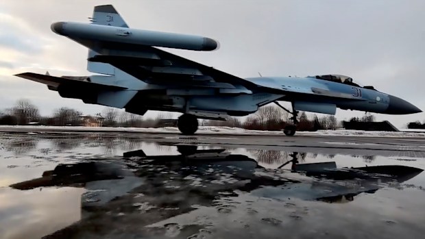 In this photo taken from video and released by the Russian Defense Ministry Press Service on Thursday, Jan. 27, 2022, a Russian Su-35S fighter jets taxies after landing on an airfield in Belarus to attend a Russia-Belarus military drills. 