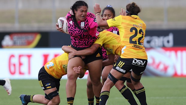 Santo Taumata of the Chiefs is tackled at FMG Stadium Waikato.