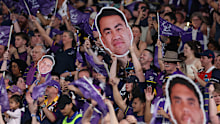 SYDNEY, AUSTRALIA - OCTOBER 05: Storm fans celebrate after a Storm try during the NRL Grand Final match between the Melbourne Storm at Brisbane Broncos at Accor Stadium on October 05, 2025, in Sydney, Australia. (Photo by Cameron Spencer/Getty Images)