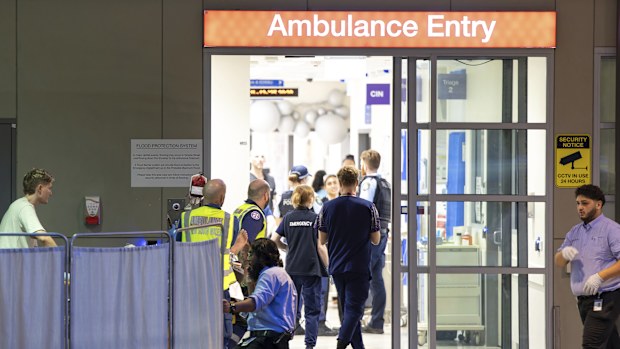 A patient is taken to St Vincent's Hospital in Darlinghurst following a mass shooting in Bondi.