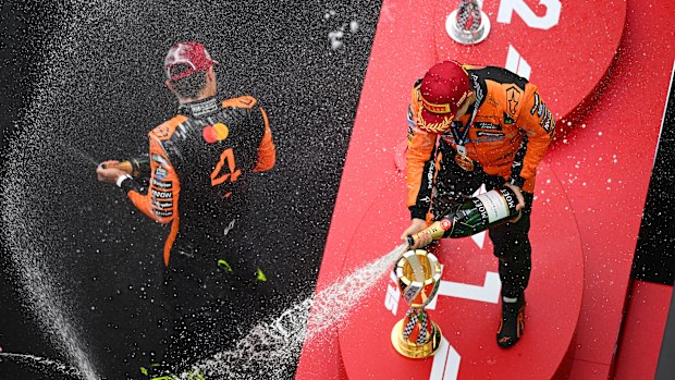 Second placed Lando Norris of Great Britain and McLaren and Race winner Oscar Piastri of Australia and McLaren celebrate on the podium with Champagne during the F1 Grand Prix of China at Shanghai International Circuit on March 23, 2025 in Shanghai, China. (Photo by Clive Mason/Getty Images)