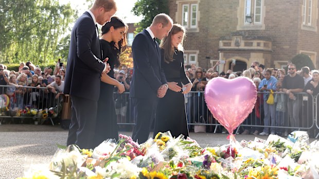 WINDSOR, ENGLAND - SEPTEMBER 10: Catherine, Princess of Wales, Prince William, Prince of Wales, Prince Harry, Duke of Sussex, and Meghan, Duchess of Sussex on the long Walk at Windsor Castle arrive to view flowers and tributes to HM Queen Elizabeth on September 10, 2022 in Windsor, England. Crowds have gathered and tributes left at the gates of Windsor Castle to Queen Elizabeth II, who died at Balmoral Castle on 8 September, 2022. (Photo by Chris Jackson/Getty Images)