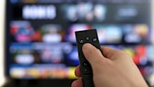 Remote control and screen - binge watching the favorite TV show