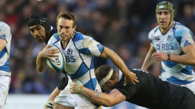 Scotand's Mike Blair takes on the All Blacks defence in 2012.