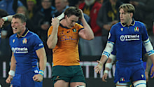 Tom Hooper of Australia removes some bandaging.