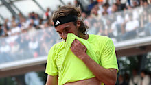 Stefanos Tsitsipas of Greece reacts against Matteo Gigante of Italy.