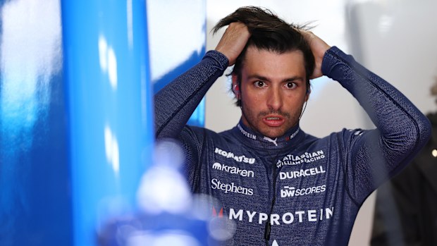 Carlos Sainz looks on in the garage during practice ahead of the F1 Grand Prix of Japan.