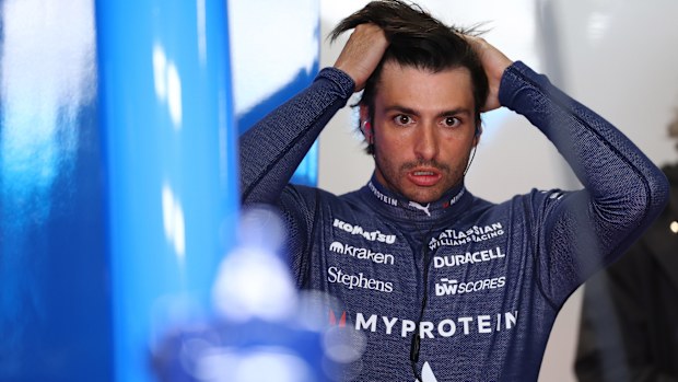 Carlos Sainz looks on in the garage during practice ahead of the F1 Grand Prix of Japan.