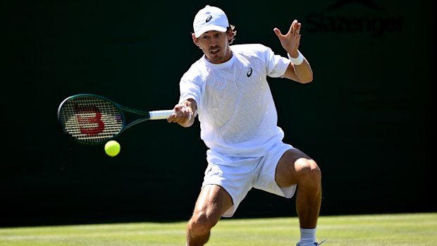 Alex de Minaur plays a forehand against Arthur Cazaux.