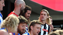 Darcy Moore of the Magpies chats with Melbourne's Max Gawn.