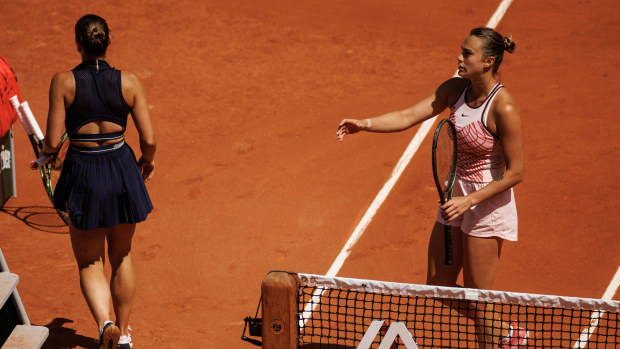 Aryna Sabalenka of Belarus goes to shake hands with the umpire after Marta Kostyuk of Ukraine refused to shake hands with her and walked straight to her chair at the end of their match in the first round of the women's singles at Roland Garros on May 28, 2023 in Paris, France. (Photo by Frey/TPN/Getty Images)