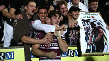 Jamie Humphreys celebrates with friends after his NRL debut. 