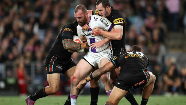 Tom Eisenhuth is tackled during the 2023 preliminary final between the Penrith Panthers and Melbourne Storm.