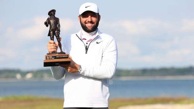 Scottie Scheffler of the United States celebrates with the trophy after winning the RBC Heritage at Harbour Town.