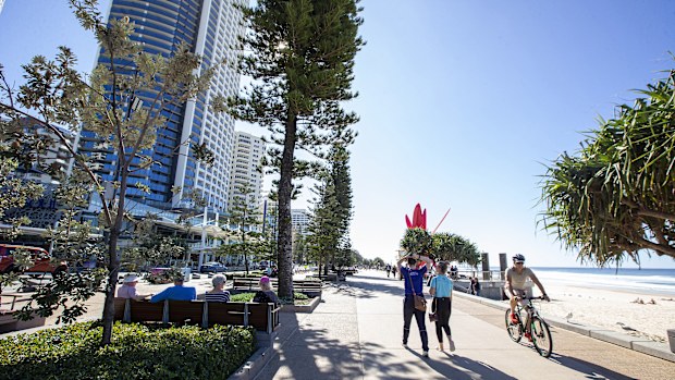 People walk along the Esplanade at Surfers Paradise on July 15, 2020 in Gold Coast, Australia. Pop up testing clinics have been established in Queensland tourist regions in a bid to detect any potential COVID-19 cases.