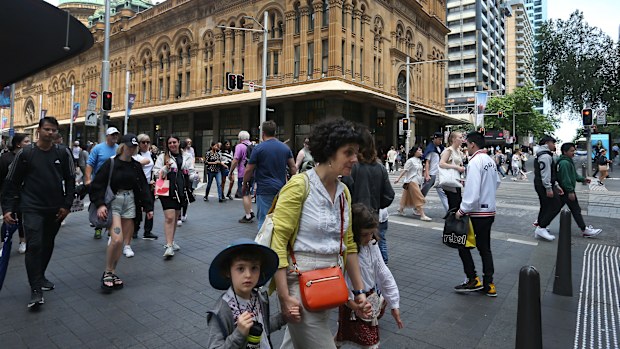 Pedestrians move along George Street on October 22, 2022 in Sydney, Australia. 