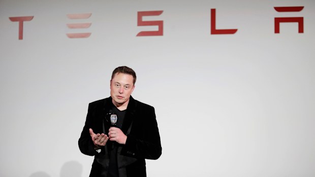 Elon Musk, CEO of Tesla Motors Inc., talks about the Model X car at the company's headquarters  Tuesday, Sept. 29, 2015, in Fremont, California.