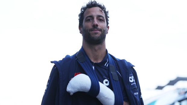 Daniel Ricciardo of Australia and Scuderia AlphaTauri wears a cast on his hand after crashing during practice which has ruled him out of competing in this weekends race ahead of the F1 Grand Prix of The Netherlands at Circuit Zandvoort on August 25, 2023 in Zandvoort, Netherlands. (Photo by Dean Mouhtaropoulos/Getty Images)