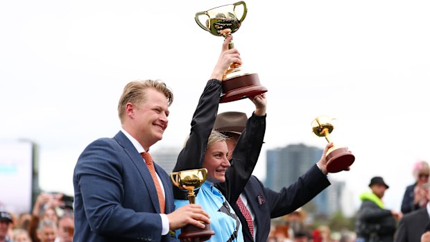 Jamie Melham celebrates with co-trainers Calvin McEvoy and Tony McEvoy.